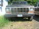 1978 Ford Bronco - Front view of a 1978 Ford Bronco, parked next to another vehicle.