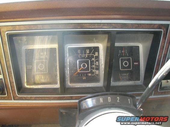 1978 Ford Bronco interior dashboard with fuel gauge, speedometer, and brake warning light