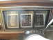 1978 Ford Bronco - The interior of a 1978 Ford Bronco shows its dashboard gauges, including fuel, speed, and brake indicators, along with the steering column.