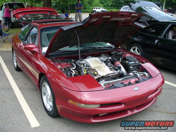 Red 1991 Ford Probe front view with hood open