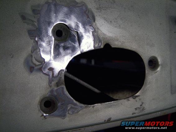 100_1374_edited.jpg where the latch is secured to door is cracked, need to prep for repair (weld)