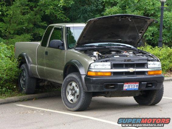 1998 Chevrolet S-10 pickup truck, front view, hood open, parked outdoors