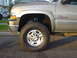 2002 Chevrolet Silverado 2500 - Close-up of the front passenger side of a 2002 Chevrolet Silverado 2500 HD truck.