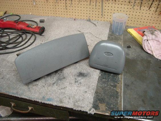 Ford airbag and dash panel on a workbench with tools