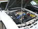 1991 Ford Mustang - Engine bay of a 1991 Ford Mustang, showing the V8 engine and other components.
