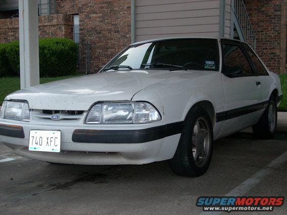 1991 Ford Mustang coupe, front view, white paint, black trim, license plate 740 XFC