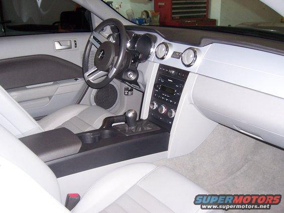 Interior view of a 2006 Ford Mustang showing dashboard, steering wheel, and seats