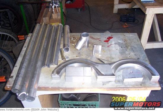 starting-assembly.jpg Just after starting it was discovered we needed to change the design, went to a bolted yoke to hold the bottles. Started cutting up material.