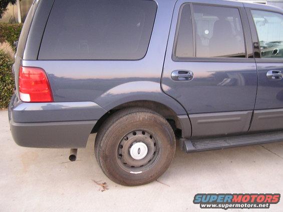 stuff-(2).jpg My Sisters '05 Ford Expedition, with Spare tire on.
I kinda like it, looks like a Police vehicle with the Black rim