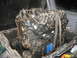 1993 Ford Explorer - A close-up view of an engine block, held by chains and straps, ready for transport or installation.