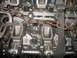 1993 Ford Explorer - This is a close-up view of an engine block, showing internal components and a chain secured with straps.