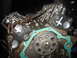 1993 Ford Explorer - Close-up view of an engine block's timing chain and gasket assembly.