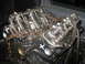 1993 Ford Explorer - Engine block with visible markings and a rusty chain secured with straps.