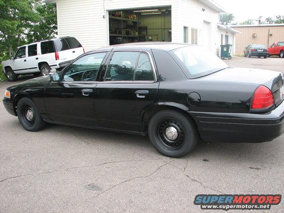 Black 2000 Ford Crown Victoria sedan, side view