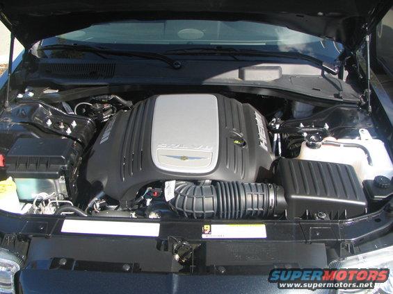 Engine bay with SRT V8 engine cover, air intake, and coolant reservoir