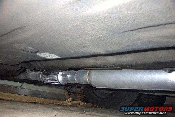 Exhaust pipe with flex connector underneath vehicle