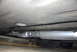 1994 Dodge Stealth - Underside view of a vehicle's exhaust system, showing a flex connector and muffler.