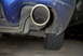 1994 Dodge Stealth - Close-up view of a car's exhaust pipe and the lower rear bumper, showing some damage.