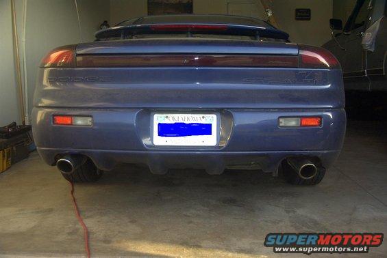 Rear view of a blue 1994 Dodge Stealth with an Oklahoma license plate and dual exhaust tips