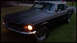 1968 Ford Mustang - Matte black 1968 Ford Mustang coupe with chrome trim and driving lights.