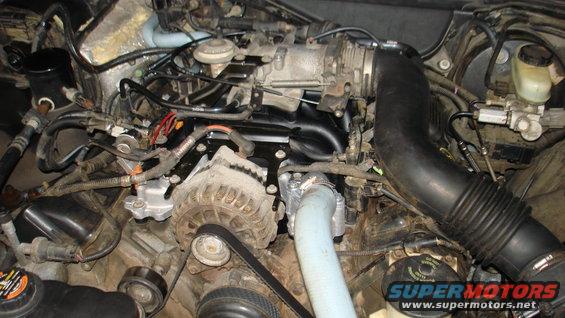 Engine intake and alternator assembly