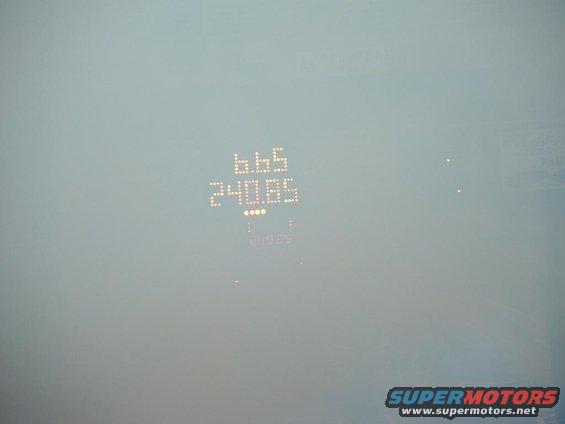 Digital dashboard display showing 665 and 240.85, with a lower reading of 249.85