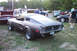 1968 Ford Mustang - Rear view of a matte black 1968 Ford Mustang fastback with a red Mustang behind it.