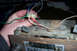 1985 Ford Bronco - Wiring is being connected to an old car stereo unit.