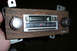 1985 Ford Bronco - This car stereo features a wood grain trim and an 'AUTO REVERSAL' display, along with AM/FM radio tuning.
