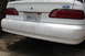 1992 Ford Taurus - Rear view of a white 1992 Ford Taurus SHO, the distinctive SHO badging on the bumper.