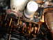 1992 Ford Taurus - Close-up view of an engine's internal components, including the crankshaft and oil pan, during maintenance.