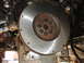 1992 Ford Taurus - The metallic flywheel is bolted to the engine's crankshaft, ready for transmission connection.