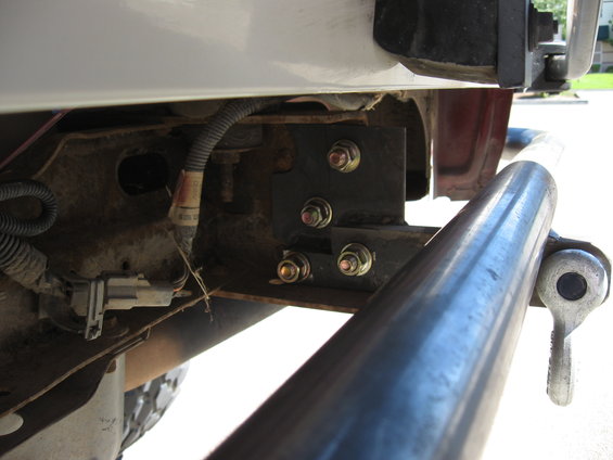 Close-up of custom rear bumper mounting brackets and hardware
