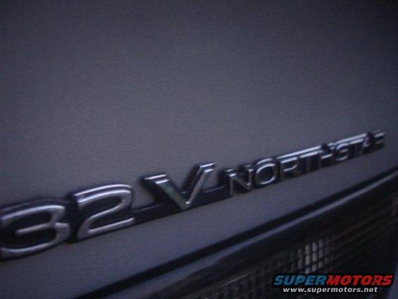 Close-up of a 3.2 V Northstar badge on a dark vehicle