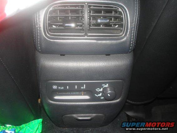 Rear climate control panel with dual vents and temperature slider