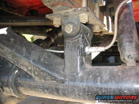 Rear axle and suspension with braided brake line and shock absorber