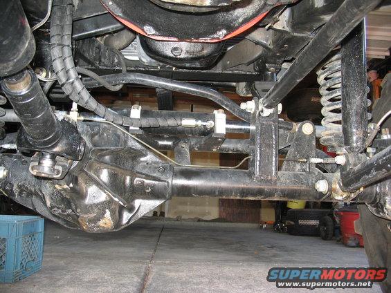 Undercarriage view showing suspension components and differential housing