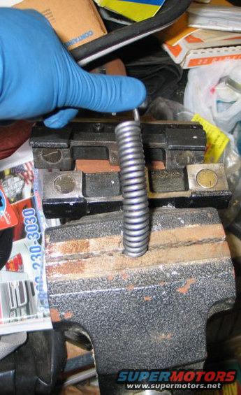 Like this.  See those gaps when you bend it?  Stick pennies in there.