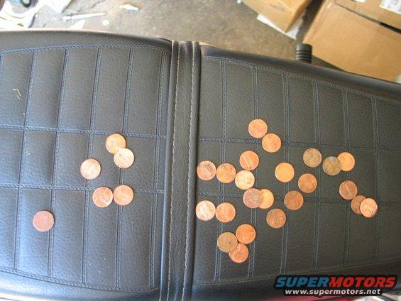 13pennies.jpg Now pull them all out with pliers.  Voila, spring installed with hardly any sweat at all.

Obviously, this only works when you have lots of clearance around the spring.