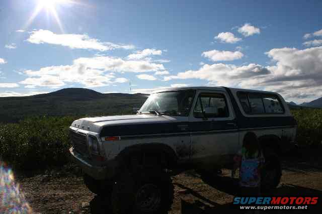 1978 Ford Bronco parked outdoors with a person sitting behind it