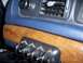 1994 Ford Crown Victoria - not centered in the middle of plastic-tree-sourced-wood trim, the metal parts behind it prevent it, plus it wouldn't be…