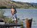 1994 Ford Probe - A man poses for a photo while standing in the water near the shore of a lake, with a wooded hillside in the background.