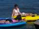 1994 Ford Probe - People relax on inflatable tubes in the water on a sunny day.