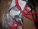 1991 Ford Bronco - Various automotive battery cables and connection terminals are shown, including red welding cable and ring terminals.