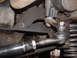 1991 Ford Bronco - Undercarriage view of a vehicle's steering and suspension system, showing mechanical components.