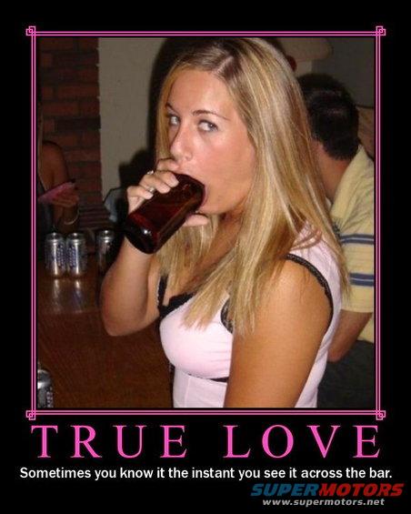 Woman drinking from a bottle at a bar