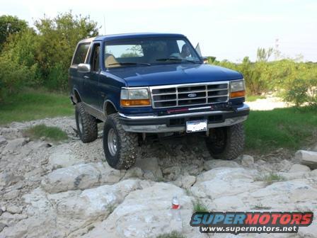 Blue 1996 Ford Bronco on rocky terrain