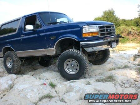 Blue 1996 Ford Bronco on rocky terrain
