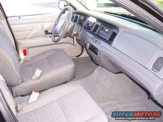 2003 Ford Crown Victoria interior, showing front seats, dashboard, and steering wheel