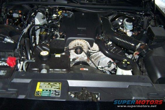 2003 Ford Crown Victoria engine bay with V8 engine, air intake, and coolant reservoir visible